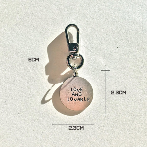 
            
                Load image into Gallery viewer, SILVER CIRCLE LOVE AND LOVABLE KEYRING
            
        